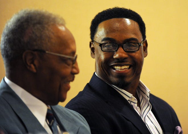 Former NFL star Brian Dawkins (right) with his former Raines football coach Freddie Stephens at the Bob Hayes Track and Field's 50th Hall of Fame induction banquet in 2014. Dawkins was voted into the NFL Hall of Fame last month. [Times-Union file]
