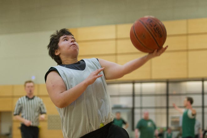 Natasha Wearth goes for a layup during the first game of the Unified Basketball League, held at The Rec on the University of Oregon campus in Eugene on Sunday, February 11, 2018. (Adam Eberhardt/for The Register-Guard)