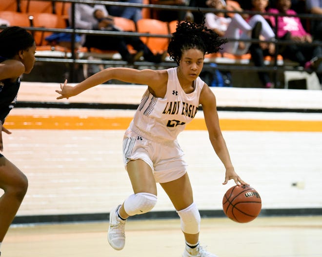 Northwood Temple Academy Ciara Moore (21) drives down the court against Fayetteville Christian in the second period of the Girls NCISSA Sandhills Conference Championship on Saturday, February 10, 2018, at Campbell University Carter Arena in Buies Creek, North Carolina. [Ed Clemente for The Fayetteville Observer]