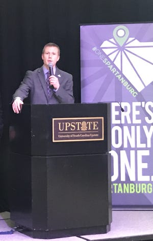 Allen Smith, Spartanburg Area Chamber of Commerce president and CEO, discusses the OneSpartanburg Scorecard during an event on Tuesday.