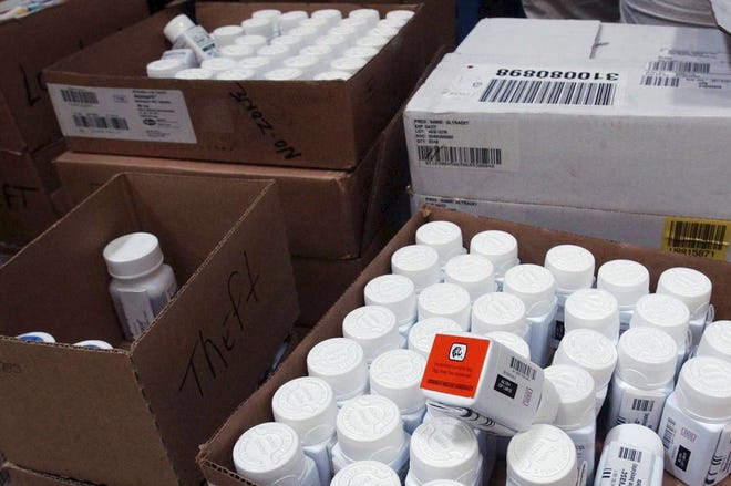 FILE - In this Sept. 1, 2004, file photo, medical bottles bearing tracking codes in the McKesson medical distribution center in Delran, N.J. President Donald Trump has made big promises to reduce prescription drug costs, but his administration is gravitating to relatively modest steps such as letting Medicare patients share in manufacturer rebates. (AP Photo/Brian Branch-Price, File)
