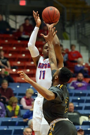 Hutchinson's JJ Rhymes shoots over Garden City's Pierre Johnson in the first half Tuesday, Feb. 6, 2018 at the Sports Arena. [Travis Morisse/HutchNews]