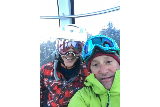 World Cup snowboard racer Robby Burns, left, and his wax technician Vinnie Poch, both of Mount Shasta, riding a gondola in Kronplatz, Italy. By Vinnie Poch