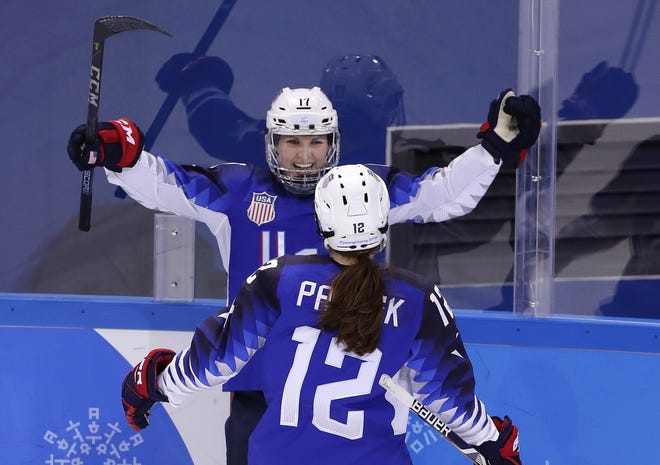 Jocelyne Lamoureux-Davidson (rear) celebrates her with Kelly Pannek after scoring for the second time in six seconds during the second period of the United States' 5-0 win over the Olympic Athletes from Russia during the Olympics in South Korea.