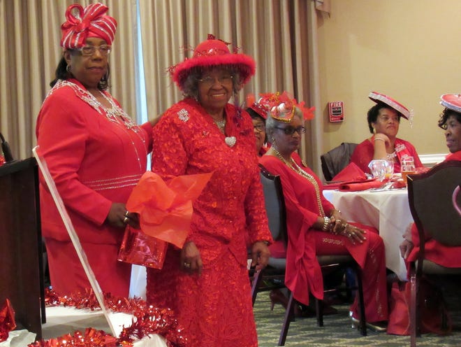 Members of the Red Hat Society attend the group's event for Women's Heart Month on Saturday, Feb. 10, 2018 at the Country Club of Petersburg. [Kate Gibson/progress-index.com]