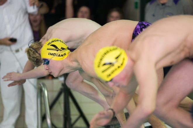 Hononegah's Zain Miles, center, competes in the third heat of the boys 200-yard individual medley during a NIC 10 varsity conference swim meet on Saturday, Feb. 10, 2018, at Freeport High School in Freeport. [SCOTT P. YATES/RRSTAR.COM STAFF]