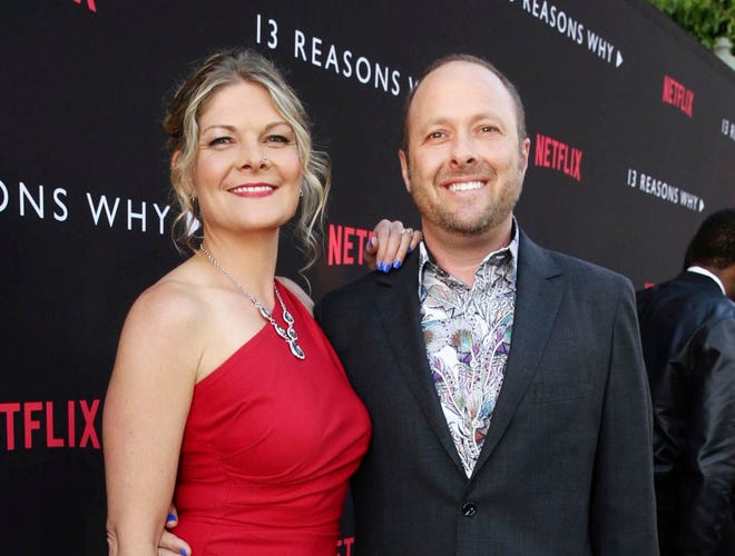 Joan Marie and Author Jay Asher appear at the Netflix "13 Reasons Why" premiere in Los Angeles on March 30, 2017. (Photo by Steve Cohn/Netflix via AP)