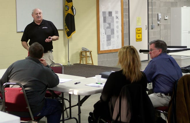 Ashland County EMA director Mark Rafeld speaks Tuesday at the mass casualty tabletop drill at the Ashland County Sheriff's Annex.