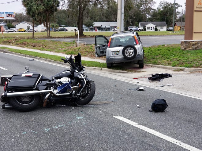 An accident between a Harley-Davidson motorcycle and a Honda CRV at the entrance of Rural King at U.S. Highway 441 on Wednesday closed all southbound lanes of 441 for much of the morning. [CARLOS E. MEDINA/DAILY COMMERCIAL]