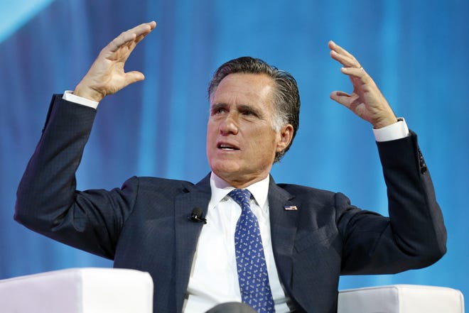 FILE - In this Jan. 19, 2018, file photo, former Republican presidential candidate Mitt Romney speaks about the tech sector during an industry conference, in Salt Lake City. Romney plans to announce his Utah Senate campaign Thursday, Feb. 15, 2018. Three people with direct knowledge of the plan say Romney will formally launch his campaign in a video. (AP Photo/Rick Bowmer, File)