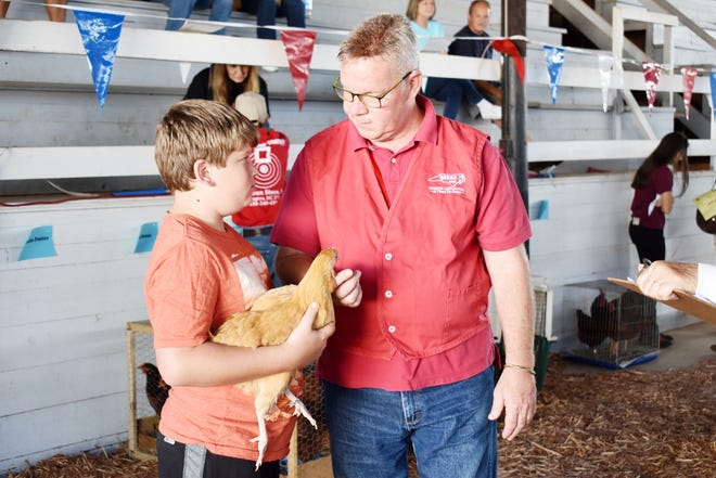 Thomas Leonard answers questions about his chicken during showmanship portion of the 2017 Davidson County Chicken Show. Dan Campeau, poultry area specialized agent for NC Cooperative Extension, served as the judge of the show and asked each participant three questions regarding their chicken and the care they provided. Leonard is the son of Michael and Shelly Leonard of Lexington. [Contributed photo]
