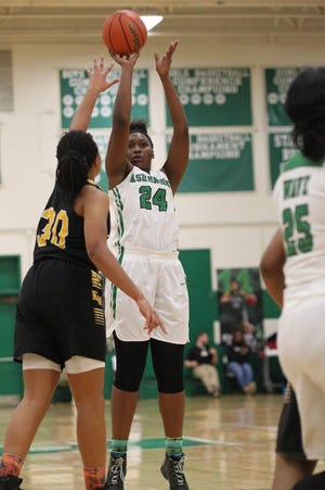 Ashbrook's Summer Schloss puts up a shot against Kings Mountain in Wednesday's conference semifinal game. The Green Wave defeated the Mountaineers 80-61 to advance to Friday's Championship game against Forestview. (Brian Mayhew / Special to the Gazette)