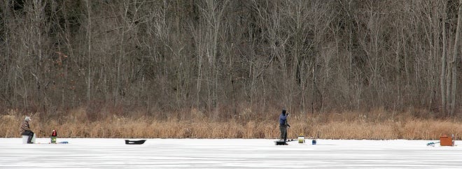Fishermen try their luck on Berry Lake in Hillsdale County. This weekend is Free Fishing Weekend in the state, allowing residents to fish without a license. [ANDY BARRAND PHOTO]