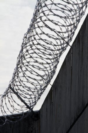 Razor wire lines the walls at the maximum security unit of the Adult Correctional Institutions. [Providence Journal photo / Bob Breidenbach]