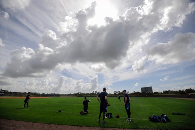 Tampa Bay Rays players gather around for practice at the team's spring training facility in Port Charlotte. [CHRIS URSO / TAMPA BAY TIMES via AP]