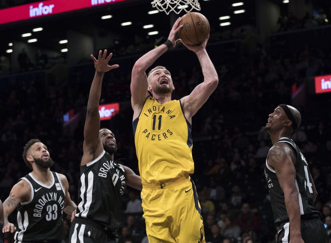 Indiana Pacers center Domantas Sabonis (11) drives to the basket against the Nets' Allen Crabbe (33), DeMarre Carroll (9) and Dante Cunningham during the first half of Wednesday night's game at the Barclays Center in Brooklyn. [The Associated Press]