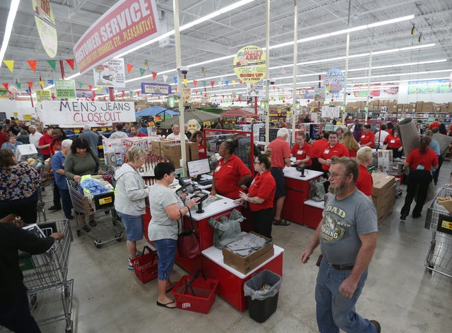 Customers check out at Ollie’s Bargain Outlet, 406 S. Tyndall Parkway in Parker. Hundreds of customers attended the grand opening Wednesday. [PATTI BLAKE/THE NEWS HERALD]
