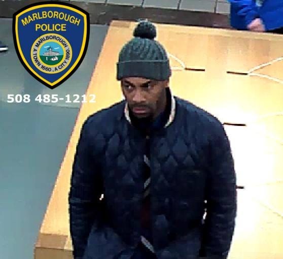 Police are searching for the man in this surveillance photo who they say stole three phones from the Apple Store at the Solomon Pond Mall earlier this month. [Courtesy photo]