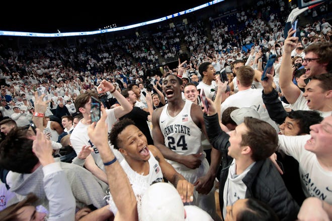 Penn State players and fans celebrate on the court after they defeated Ohio State in an NCAA college basketball game in State College, Pa., Thursday, Feb. 15, 2018.(AP Photo/Chris Knight)