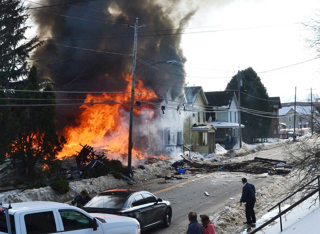 A massive fire broke out at a home on West Main Street in Little Falls on Wednesday following a reported explosion. Debris from the home is pictured on the street in front of it. Three homes were believed to be a total loss and no fatalities were reported. [JONATHAN SHAFFER/TIMES TELEGRAM]