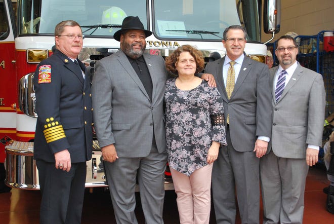 Gastonia Fire Chief Phil Welch, Mayor Walker Reid, and city council members Jennifer Stepp, Jim Gallagher and Robert Kellogg gather in front of the new Ladder 3 truck. Pictured on page D1, people attending the event join together to “push in” the new Ladder 3 fire apparatus into Station 3. [PHOTOS COURTESY OF CITY OF GASTONIA]