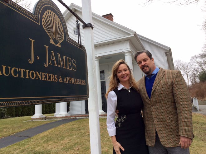 Elizabeth and Josh Rioux pose in front of J. James Auctioneers & Appraisers' new home at 190 Court St., Cold Spring Chapel, where auctions will be held and the church will conntinue to host weddings and services. [Wicked Local Photo/Emily Clark]