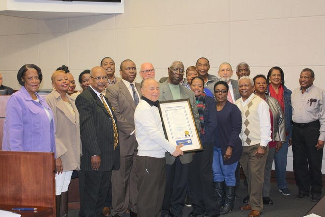 Left to right: Mildred Brown, Judy Irvin, Wanda August, Gwen Price, Pastor Tobias, Senator Ed Price, Councilman Travis Turner, Councilman Randy Clouatre, President Kenny Matassa, honoree Jesse Bartley, Louise Stewart, Dorothy Claiborne, Vurnel Brown, Chanel Porter, Councilman Oliver Joseph, Charles Shivers, Pete Prater, Sheila Irvin, Lois Pam, and Andrew Thompson.