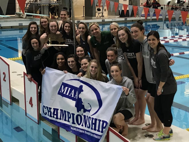 The Duxbury High girls swimming and diving team celebrates after winning the program's fourth straight South Sectional crown on Saturday, Feb. 10 at MIT. The Dragons will try for a second straight Div. 2 state championship on Saturday at Boston University.