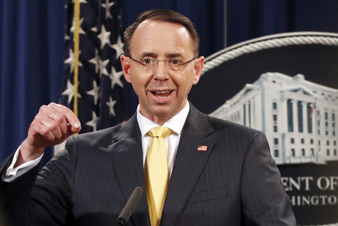Deputy Attorney General Rod Rosenstein, speaks to the media with an announcement that the office of special counsel Robert Mueller says a grand jury has charged 13 Russian nationals and several Russian entities, Friday, Feb. 16, 2018, in Washington. The defendants are accused of violating U.S. criminal laws to interfere with American elections and the political process. [Jacquelyn Martin/The Associated Press]