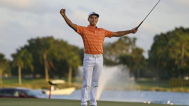 Rickie Fowler celebrates on the 18th green after winning the 2017 Honda Classic Sunday February 26, 2017 at PGA National in Palm Beach Gardens. (Bill Ingram / The Palm Beach Post)
