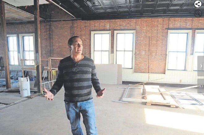 Alex Stylos talks about how his team is transforming the old Connell School in Fall River into a muti-use facility, including apartments, bar and coffee shop. “I tell my guys, don’t try to outsmart the building," he said. "It knows what it is doing. Work with it.”  [FALL RIVER HERALD NEWS/DAVE SOUZA]