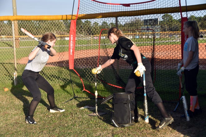 The Destin Middle School Marlins are getting in their cuts duing practice. The Marlins open up on March 5 at home against the Pryor Pirates. [TINA HARBUCK/THE LOG]