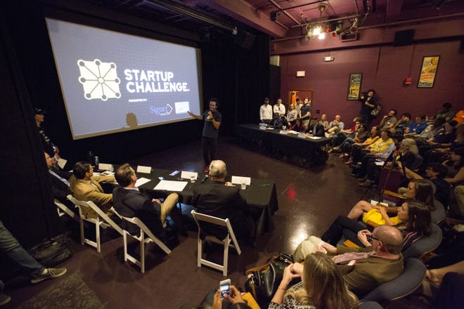 Andy Chavez, a cofounder of BehaviorMe, pitches the company and idea to a panel of judges during the final round of Startup Challenge 18 at the Hippodrome State Theater in downtown Gainesville on Tuesday. [Lauren Bacho/Staff photographer]