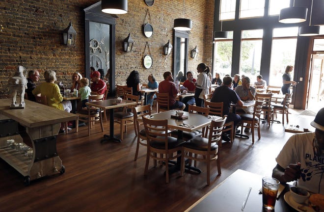 Patrons eat lunch at Sweet Home Food Bar now open on University Boulevard in downtown Tuscaloosa Monday, Aug. 25, 2014. Michelle Lepianka Carter | The Tuscaloosa News