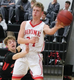 Boone senior Dresden Wilson makes a pass from the baseline during Monday’s Class 3-A Substate opener. Wilson and the Toreadors won 58-50 over Gilbert and will play again Thursday. Photo by Andrew Logue/News-Republican
