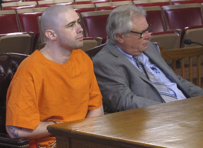 Prison inmate Casey Pigge, left, waits before he enters his guilty plea to strangling a fellow prisoner in a transport van earlier this year, at a hearing attended by his lawyer, Steve Larson, right, on Wednesday, Sept. 27, 2017, in Circleville, Ohio. Pigge, 29, pleaded guilty to killing David Johnson and was immediately sentenced to 25 years in prison. Pigge declined to say anything to the judge before he was sentenced; he is already serving two other prison terms for two previous killings. (AP Photo/Andrew Welsh-Huggins)
