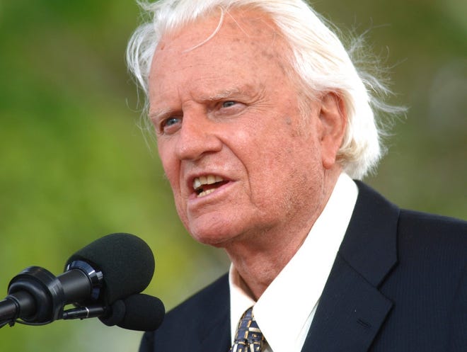 In this June 26, 2005 file photo, the Rev. Billy Graham speaks on stage on the third and last day of his farewell American revival in the Queens borough of New York. A spokesman said on Graham has died at his home in North Carolina at age 99. (AP Photo/Henny Ray Abrams)