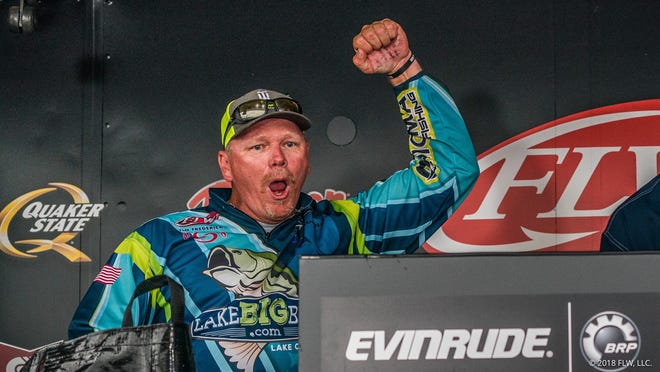 Leesburg's Tim Frederick celebrates winning the FLW Tour at Lake Okeechobee presented by Evinrude in Clewsiton on Sunday. [ANDY HAGEDON / FLW]