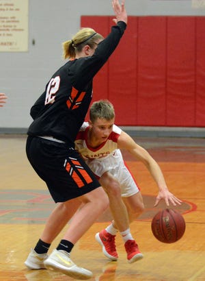 UNCASVILLE 2-9-2018 St. Bernard's Hunter Baillargeon tries to get around Plainfield's Chris Peasley Friday during their game in Uncasville. [John Shishmanian/ NorwichBulletin.com]