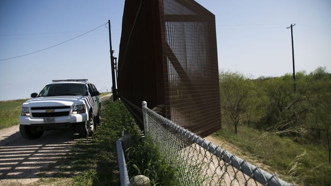 A Border Patrol vehicle guards a section of border fence on Tuesday, February 14, 2017 in Runn, Texas.