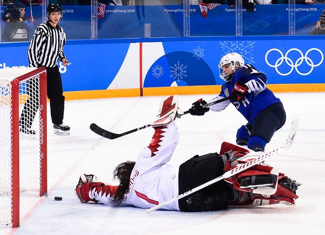United States' Jocelyne Lamoureux (17) scores the game-winning goal in the shootout against Canada during the women's gold medal hockey game at the 2018 Winter Olympics in Gangneung, South Korea, Thursday, Feb. 22, 2018. (Nathan Denette/The Canadian Press via AP)