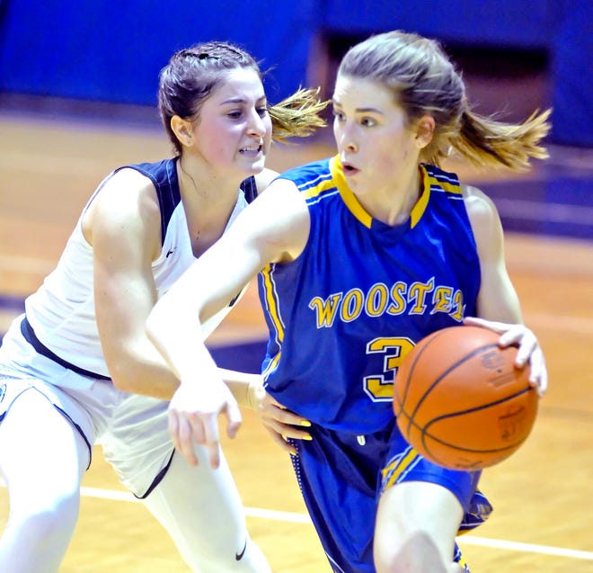Wooster's Macyn Siegenthaler (right) dribbles past Hoban's Alex Whitmore during their Div. I sectional final Thursday at Hoban. Siegenthaler scored a game-high 25 points in the Generals' 65-64 win over the Knights.