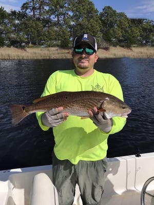AJ shows off his 6.13 pound red. [CONTRIBUTED PHOTOS]
