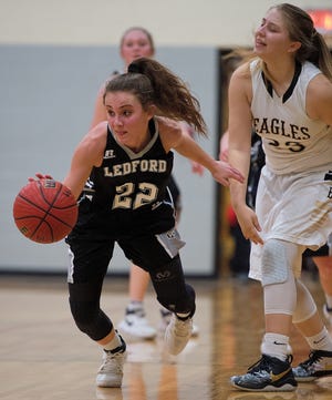 Ledford's Ashley Anthony gets past East Davidson's Bailey Grimsley. [Donnie Roberts/The Dispatch]