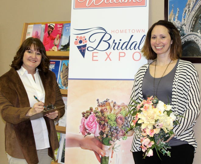 Making plans for the Hometown Bridal Expo are Christina Boyer and Heather McNew from All Aboard Travel. [NANCY HASTINGS PHOTO]