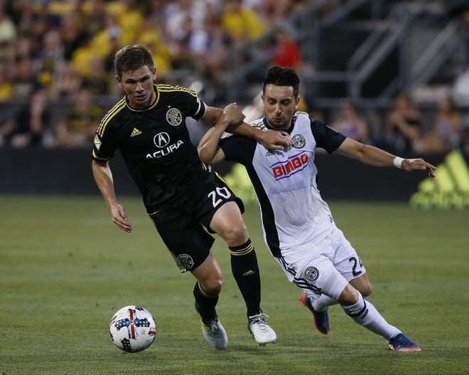 Midfielder Wil Trapp, left, felt his play and confidence improved as the 2017 season went along. [Jonathan Quilter]