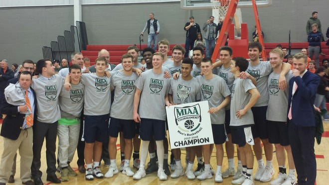 The Hope men celebrate the MIAA tournament title with a win over Olivet at the Cutler Events Center. [Lukas Cimbal/Sentinel contributor]