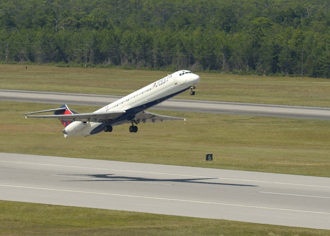 A Delta flight takes off on a runway at Destin Fort Walton Beach Airport. [FILE PHOTO/DAILY NEWS]