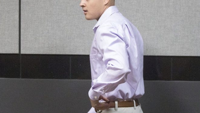 Cristian Leon, the West Palm Beach man accused of impersonating a police officer to obtain sexual favors from an exotic dancer and another woman in 2016, enters a Palm Beach County courtroom Wednesday. (Damon Higgins / The Palm Beach Post)