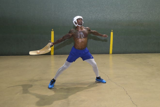 Former University of Miami student athlete Tanard Davis trains at American Amateur Jai Alai in Miami on Feb. 8. Now nearly extinct, jai-alai was once hugely popular up and down the Eastern Seaboard. [David Santiago / Miami Herald via AP]